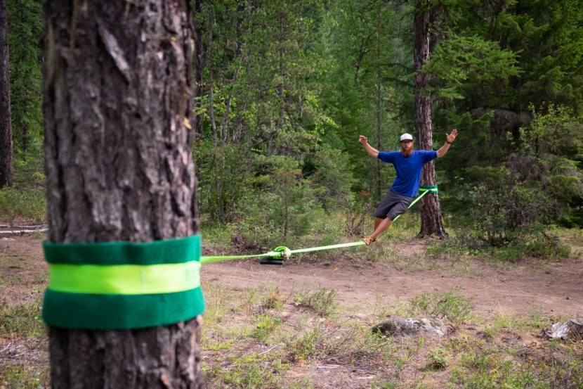slackline - surfing the line in the idaho pines.