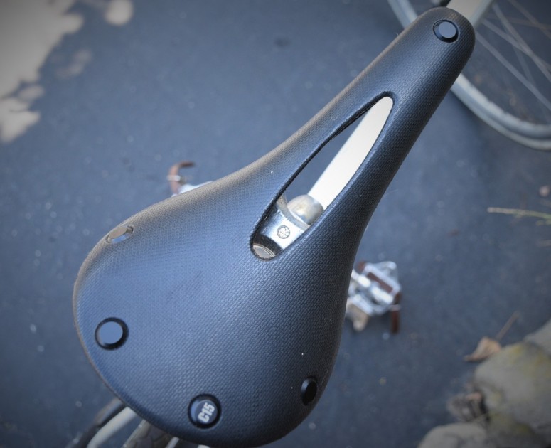 the firm, unpadded seating platform and the abrupt pressure relief...