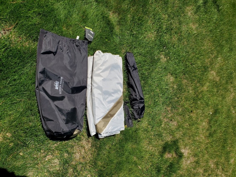 rei co-op screen house - carrying bag with shoulder strap and shelter contents laid out
