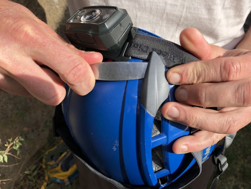 mammut skywalker 2 - using a butter knife to help us pry the headlamp attachment clips...