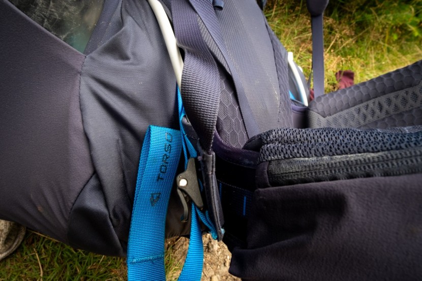 the north face griffin 65 - the torso adjustment is located down by the right hip. you can use...