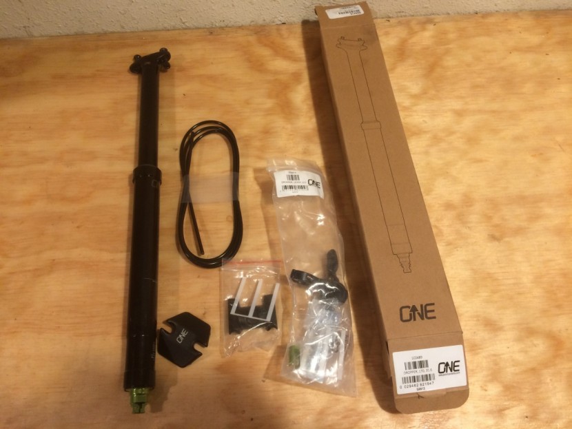 oneup dropper - the post comes in a few pieces including housing, shims, the saddle...