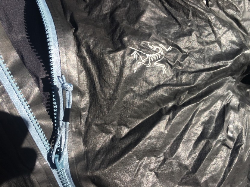 arc'teryx norvan sl hoody for women - the waterproof zipper uses a flap instead of making the zipper...