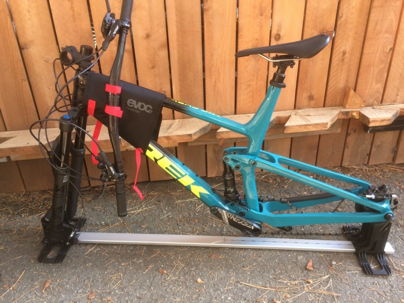 the bicycle mounts on a stand that bolts into the travel case.
