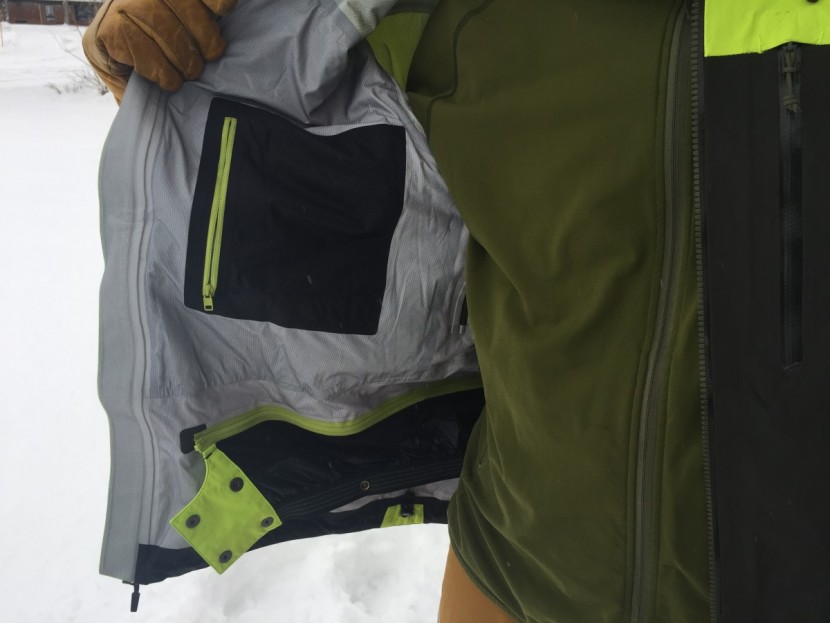 flylow lab coat - on display are the removable powder skirt, internal chest pocket...