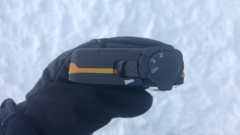 a close up of the housing and switch on the older tracker3.