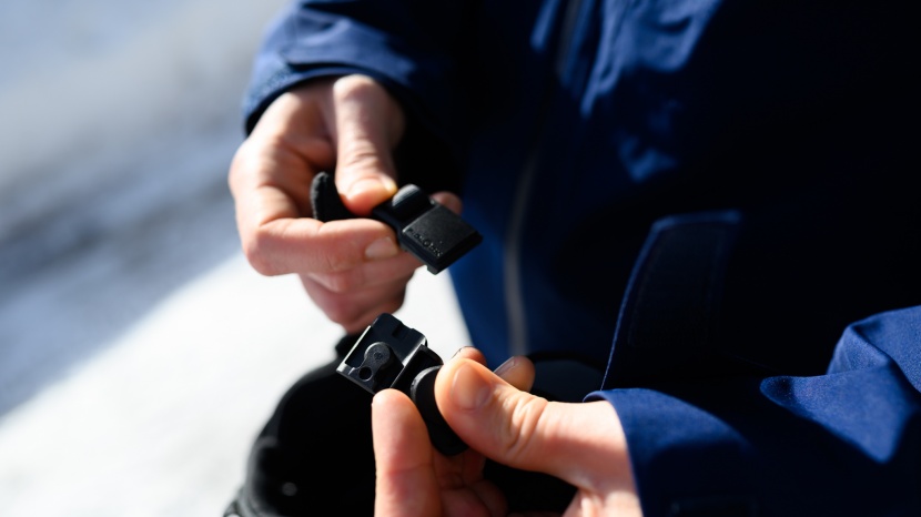 ski helmet - this buckle slides to lock into place with magnets for convenience.