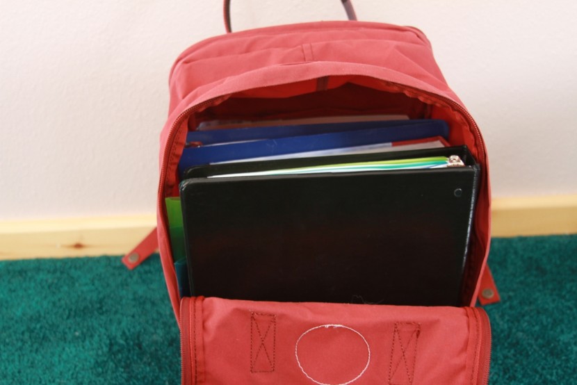 fjallraven kanken 15" - here we fit two binders and textbooks inside the boxy design. it can...