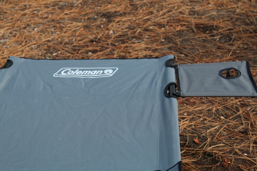 coleman pack-away cot - you can swap the bedside table to either side of this cot.