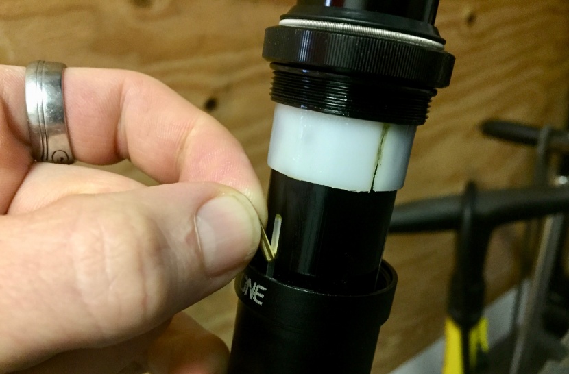 oneup components v2 - you can shorten the travel by inserting "shims" into the slots...