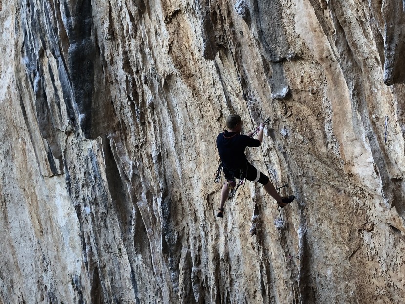 quickdraw - lowering off and trying to clean the draws on a steep route. this is...