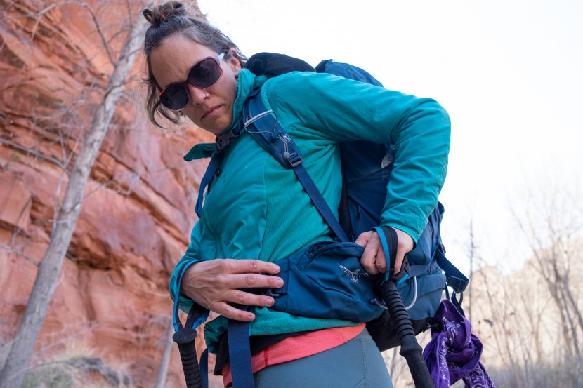 osprey kyte 46 - positioned behind the hip, accessing this pocket can feel a bit like...