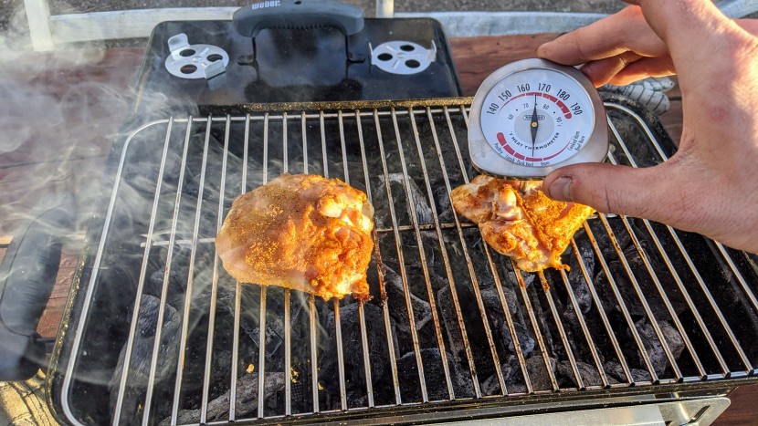 portable grill - slow roasting some dry-rubbed curry chicken to perfection on the...