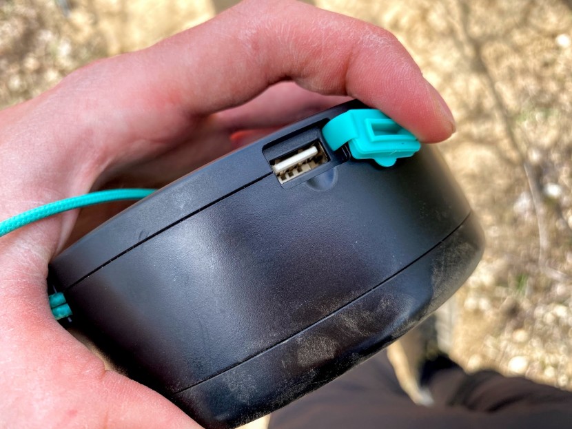 the usb charge out port has a secure rubber cover to keep dust out.