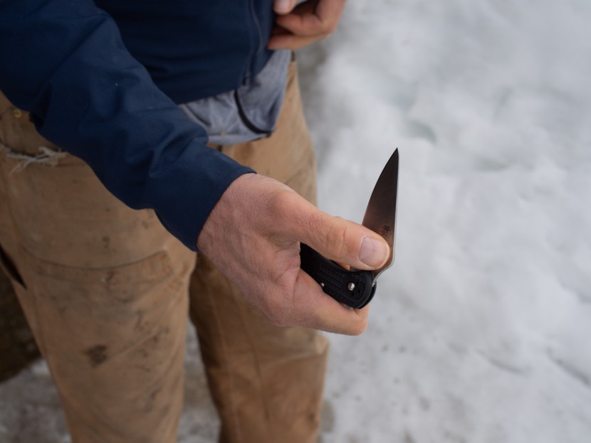 spyderco delica 4 - this tester's thumb is opening the blade using the hidden hole in...