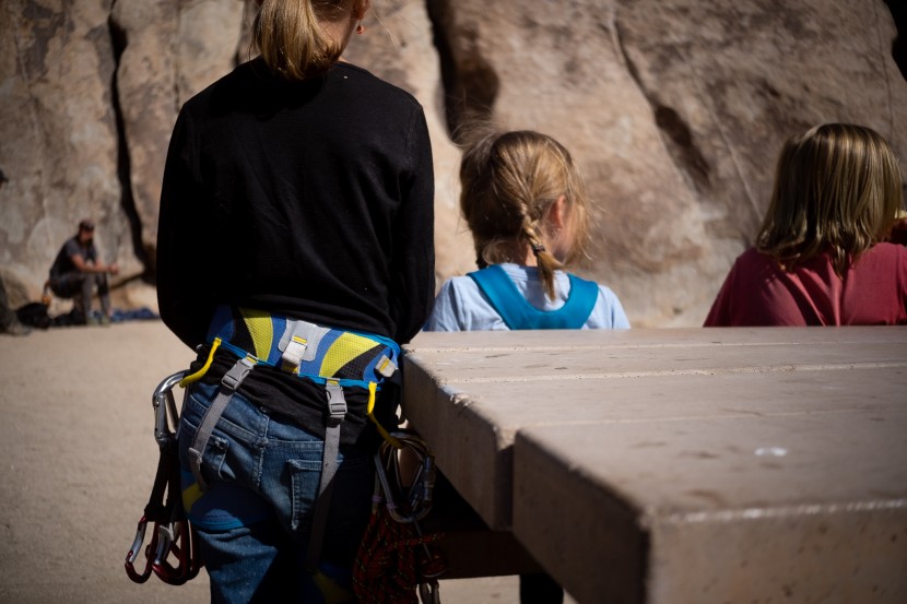 mad rock solar - waiting for her turn to climb, luckily her harness is comfortable...