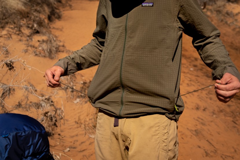 patagonia r1 techface hoody - we love that the hem elastic tails store inside the pocket so they...