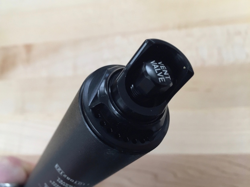 rockshox reverb axs - unscrew the cap of the vent valve and release unwanted air from the...