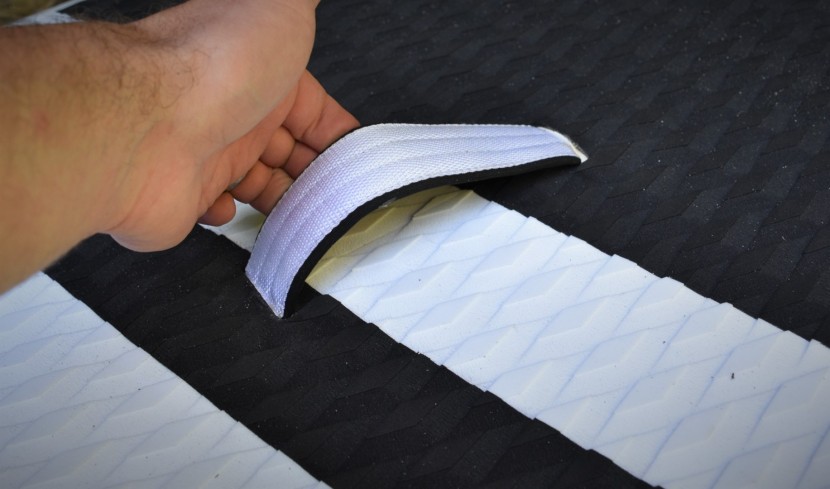 the roc's single center grab handle allows the lightweight board to...