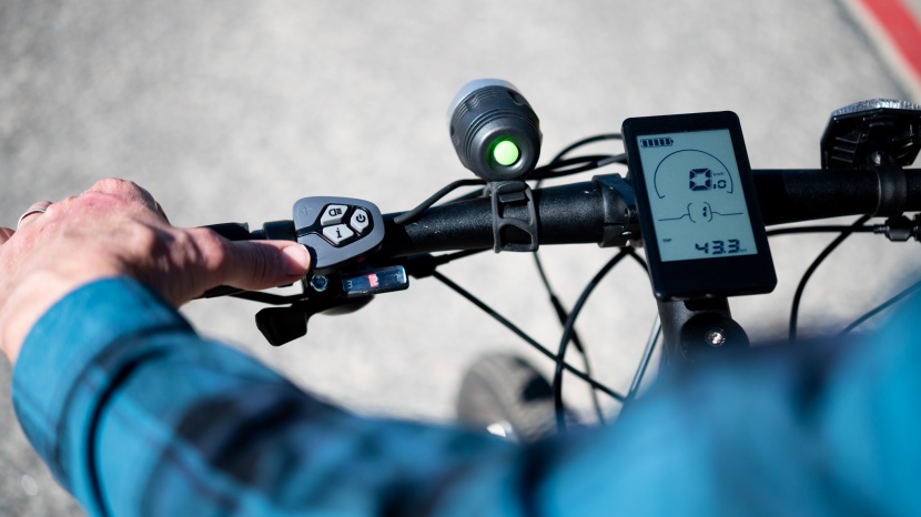 ancheer 27.5-inch blue spark electric bike - the controls are ergonomic and the large digital display is front...