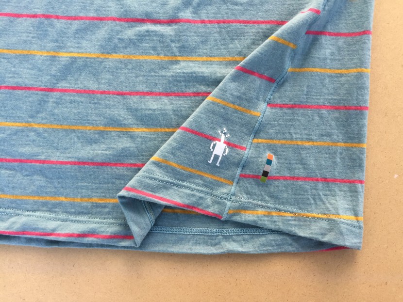 smartwool merino 150 short sleeve for women - there are reflective decals on the left side of the shirts.