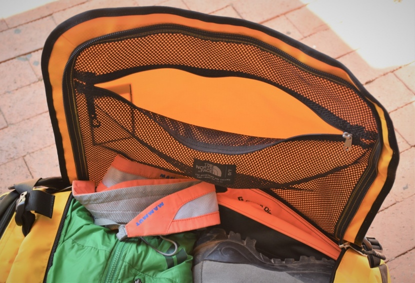 the north face base camp - the large mesh zippered pocket underneath the top lid provides...