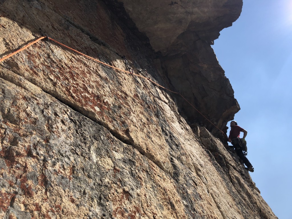 dmm revolver - derek pulls around the bulge on a traversing second pitch. notice...