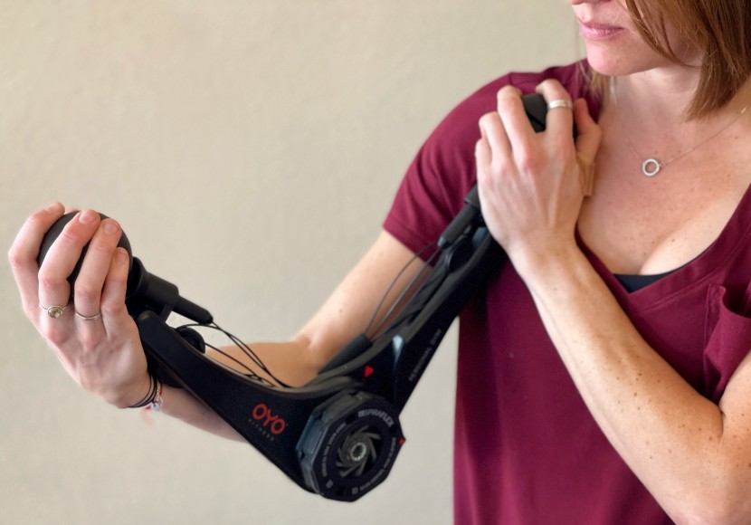 portable home gym - this may look like a bionic arm, but don't be fooled. the oyo system...