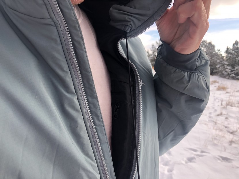 arc'teryx atom ar hoody - dual drawcords located on the inside of the collar allow one to...