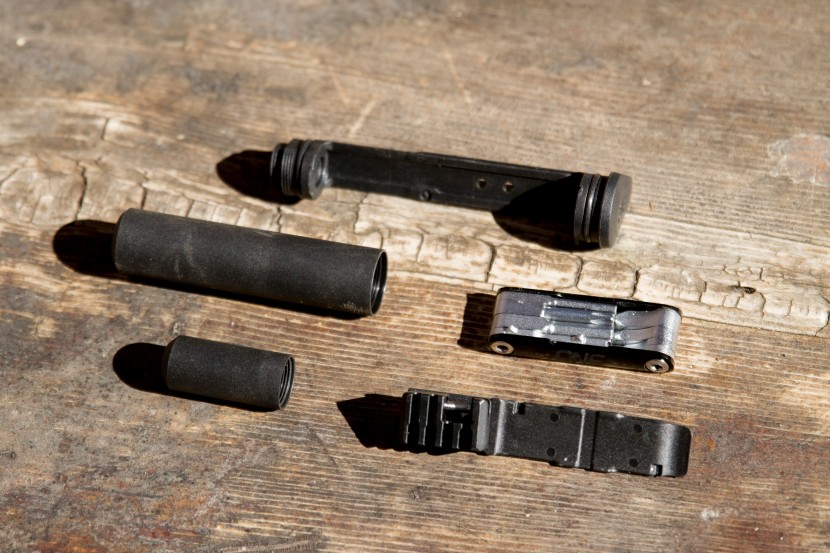 oneup components edc v2 - between the threaded storage containers, the chain breaker/tire...