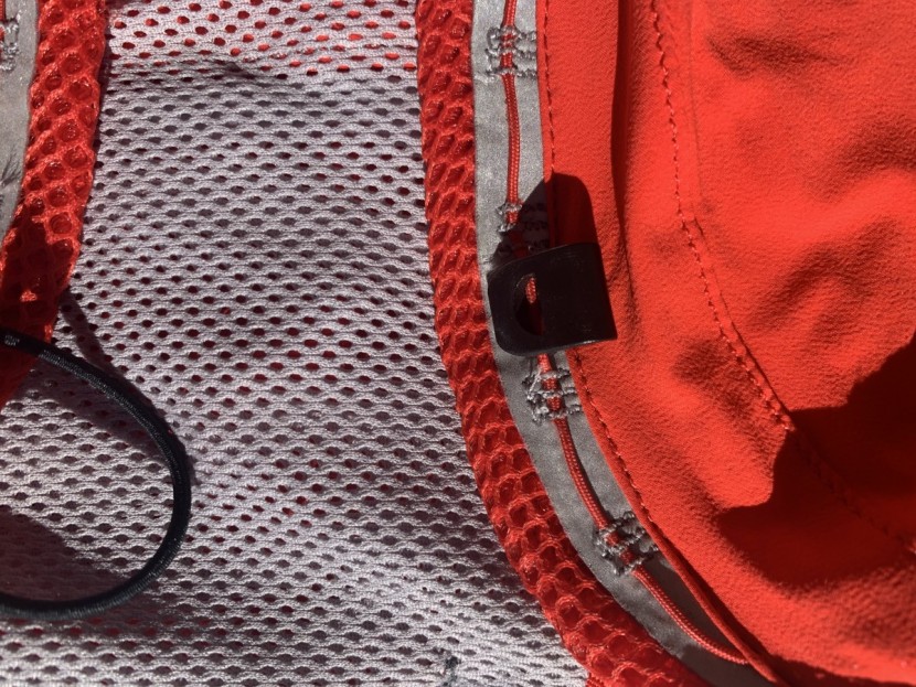 the clasp flipped over to blindly weave the cord into the "v" shaped...