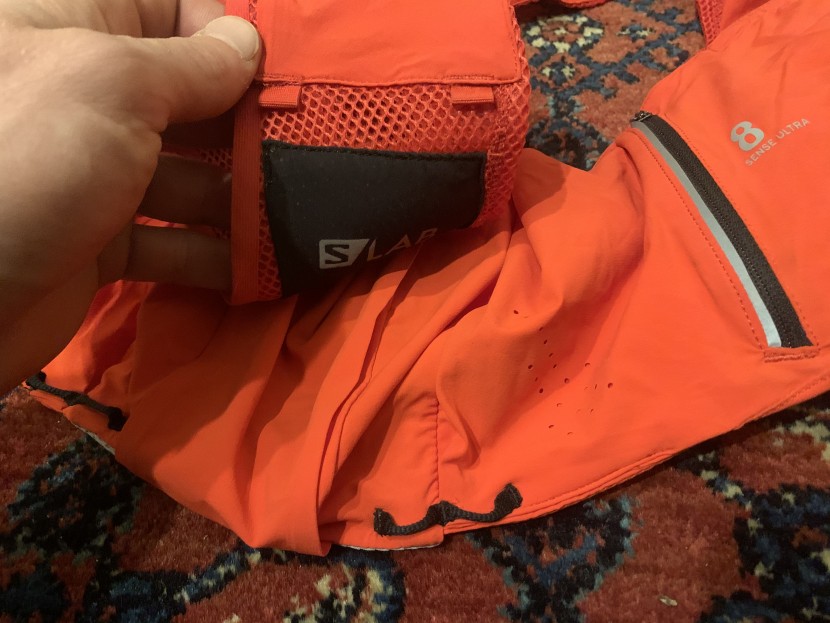 salomon s/lab sense ultra 8 set - tabs on the top of each shoulder strap and loops above each hip...