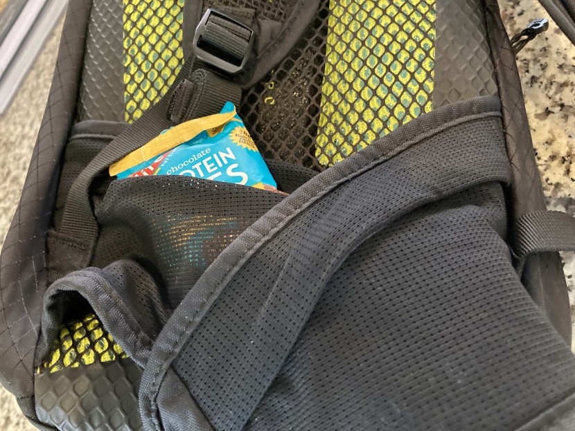 camelbak m.u.l.e. pro 14 - the mesh hip pockets have a flap at the top, which is not entirely...