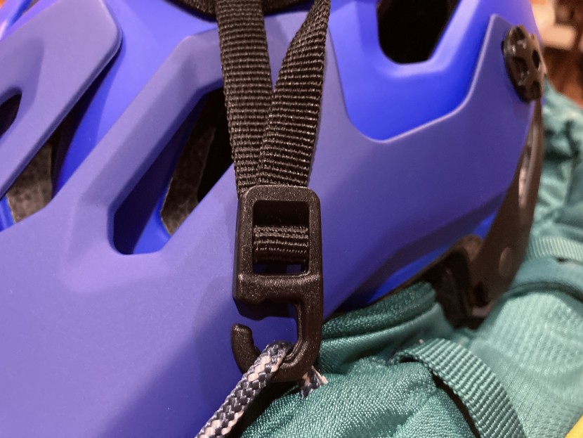 deuter compact exp 12 - the helmet carry clips into accessory cord located on the side of...