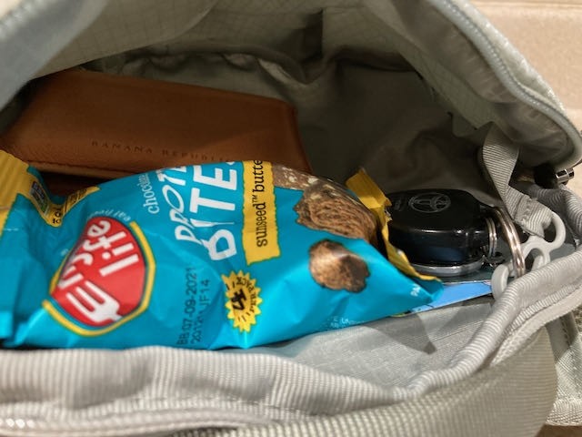 the top lid has a larger zippered pocked to store your smaller...