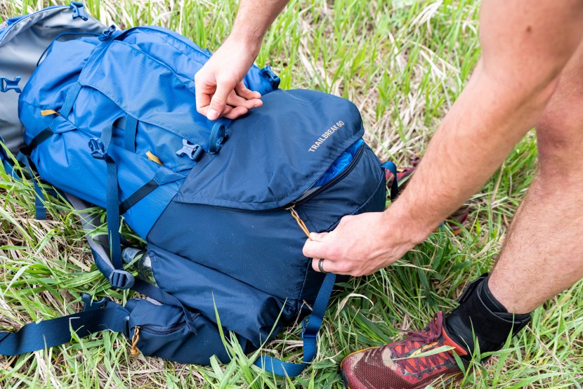 rei co-op trailbreak 60 - the bottom opening's zipper teeth and storm flap are thick adding to...