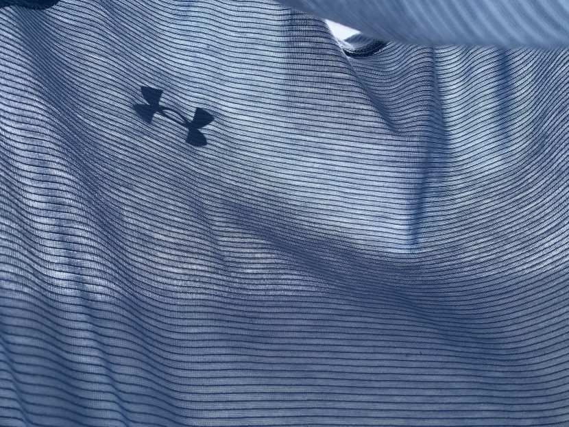 running shirt - a linear weave of stretch-poly used throughout most of the shirt...