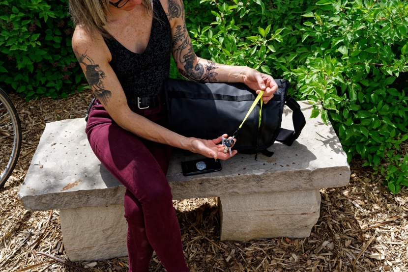 the outer zippered pocket has a long leash for minding your keys.