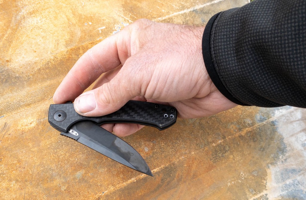 zero tolerance 0450 sinkevich carbon fiber - not everyone loves a finger-flip opening. you can get used to it...