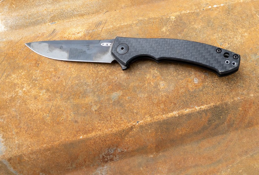 zero tolerance 0450 sinkevich carbon fiber - the blade took on some strange, moving colorations. best we can tell...