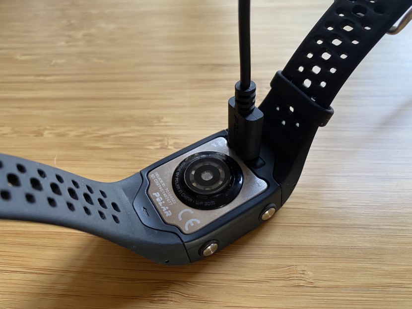 polar m430 hr - the battery charger is located on the back of the watch and makes a...