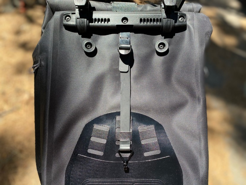 the lower rack security measure is a tension strap that has a fixed...