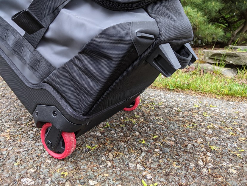 the north face rolling thunder 30" - the two fixed wheels roll well but don't corner as sharply as...