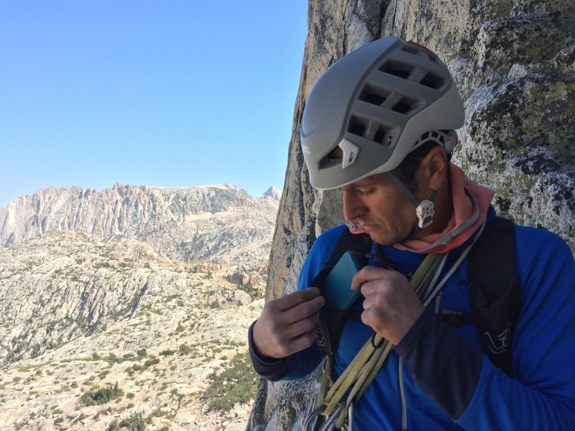 ultimate direction scram - an iphone 12 mini in a lifeproof case fits in this zippered pocket...