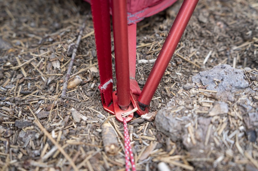 fitting two poles and a rainfly attachment into a single corner...