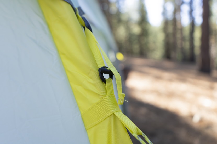 the pin and hole connection to attach the rainfly to the tent.