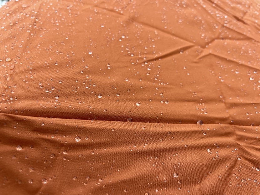 a closure look at how rain beads on the fabric.