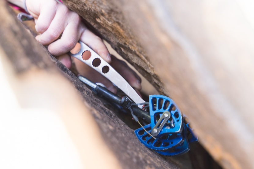 nut tool - fishing out a cam with the torque's hooked head.