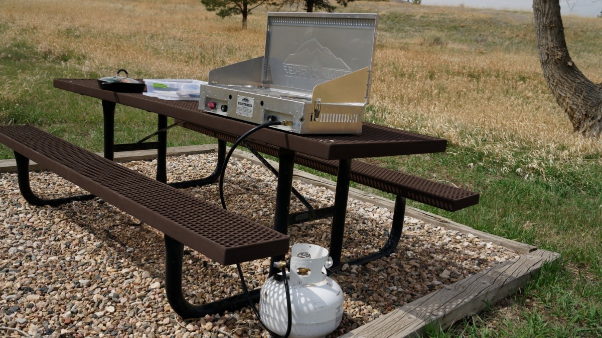 Camp Chef Mountaineer 2X Review (We love this aesthetically pleasing stove for being durable, fuel efficient, and resisting wind like a champion.)