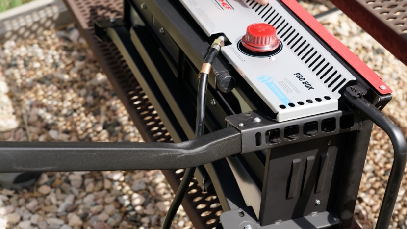 once you fully swing the legs out, the button locks into place...